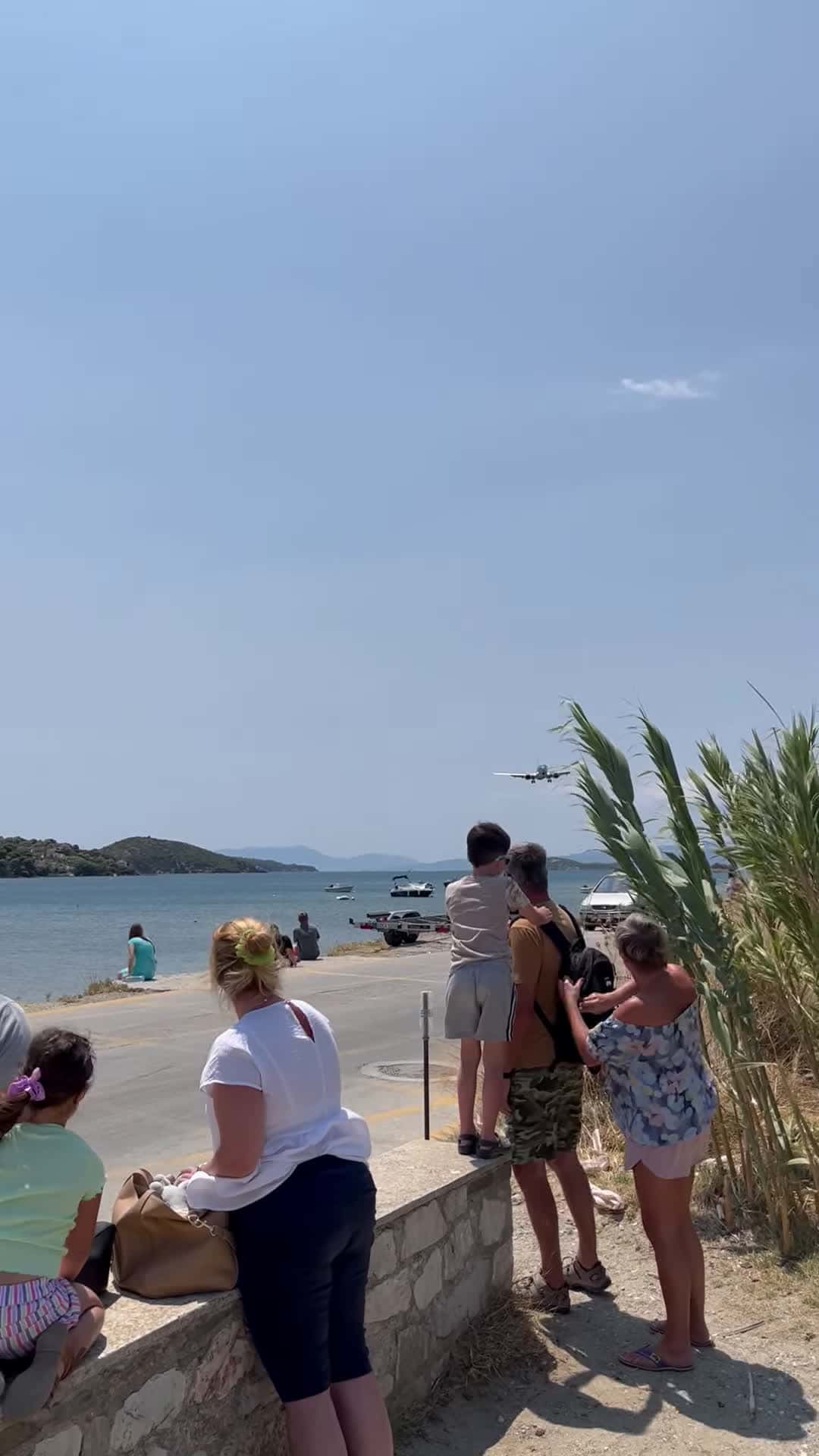Cover for #CaughtOnCamera Airplane Landing Close to Beachgoers.