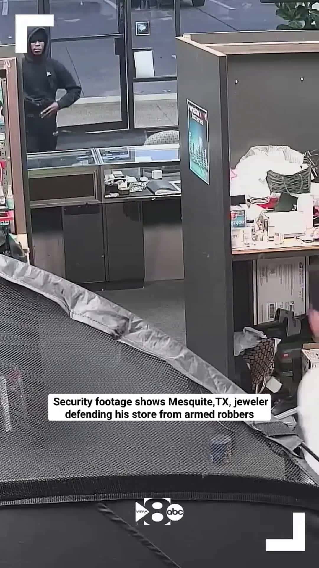 Cover for Security footage shows Texas jeweler defend himself in shootout with robbers 