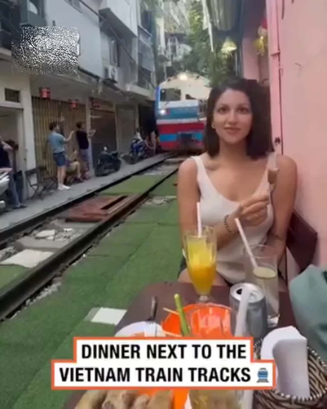 Cover for Dining right next to the train trucks in Vietnam 