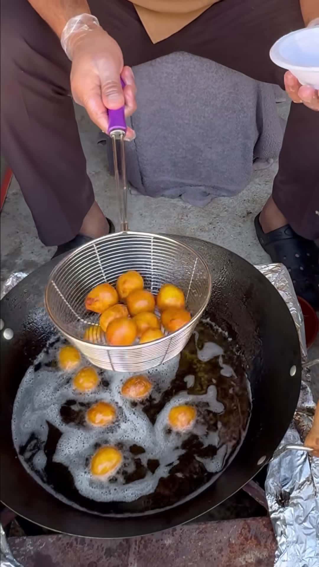 Cover for We’re at @thecamelfarmdubai watching traditional Luqaimat being made. 🤯