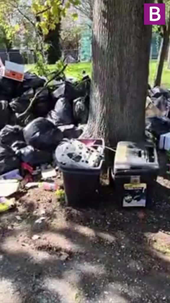 Cover for Some desperate residents have taken to following the trucks clutching black bin bags at th 02870 #us