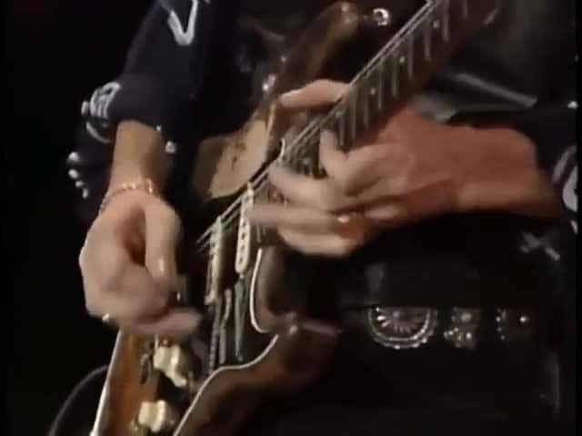 Cover for SRV and roadie Rene Martinez pull off the Formula 1 of guitar changes in Austin 1989 — the slickest live guitar swap you'll ever see 🎸 #StevieRayVaughan #GuitarTech #Austin1989 #LiveMusic #BluesRock