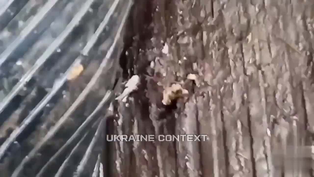 Cover for Russian soldier shows Lada wrecked by Ukrainian drone strike—shrapnel injures 'Igor' 🚗💥 #UkraineWar #DroneStrike #ConflictFootage