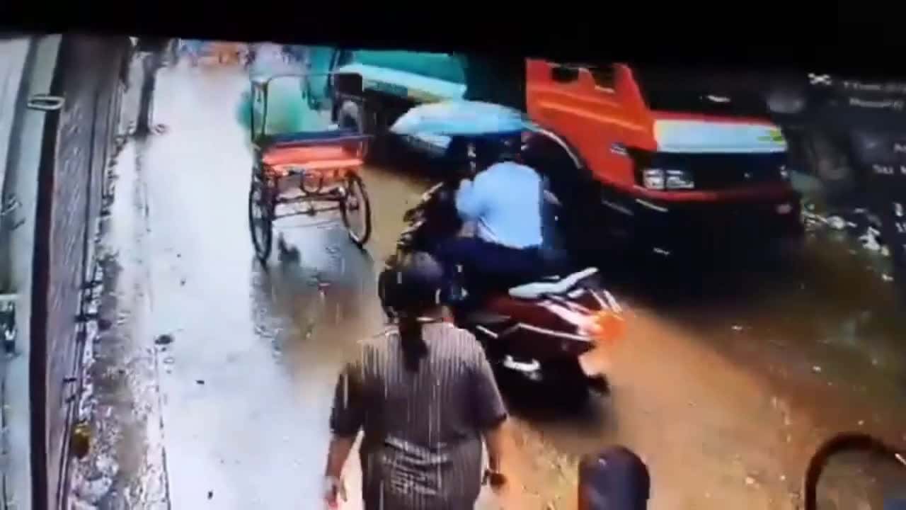 Cover for Motorcycle rider and passengers dodge landslide crashing onto road