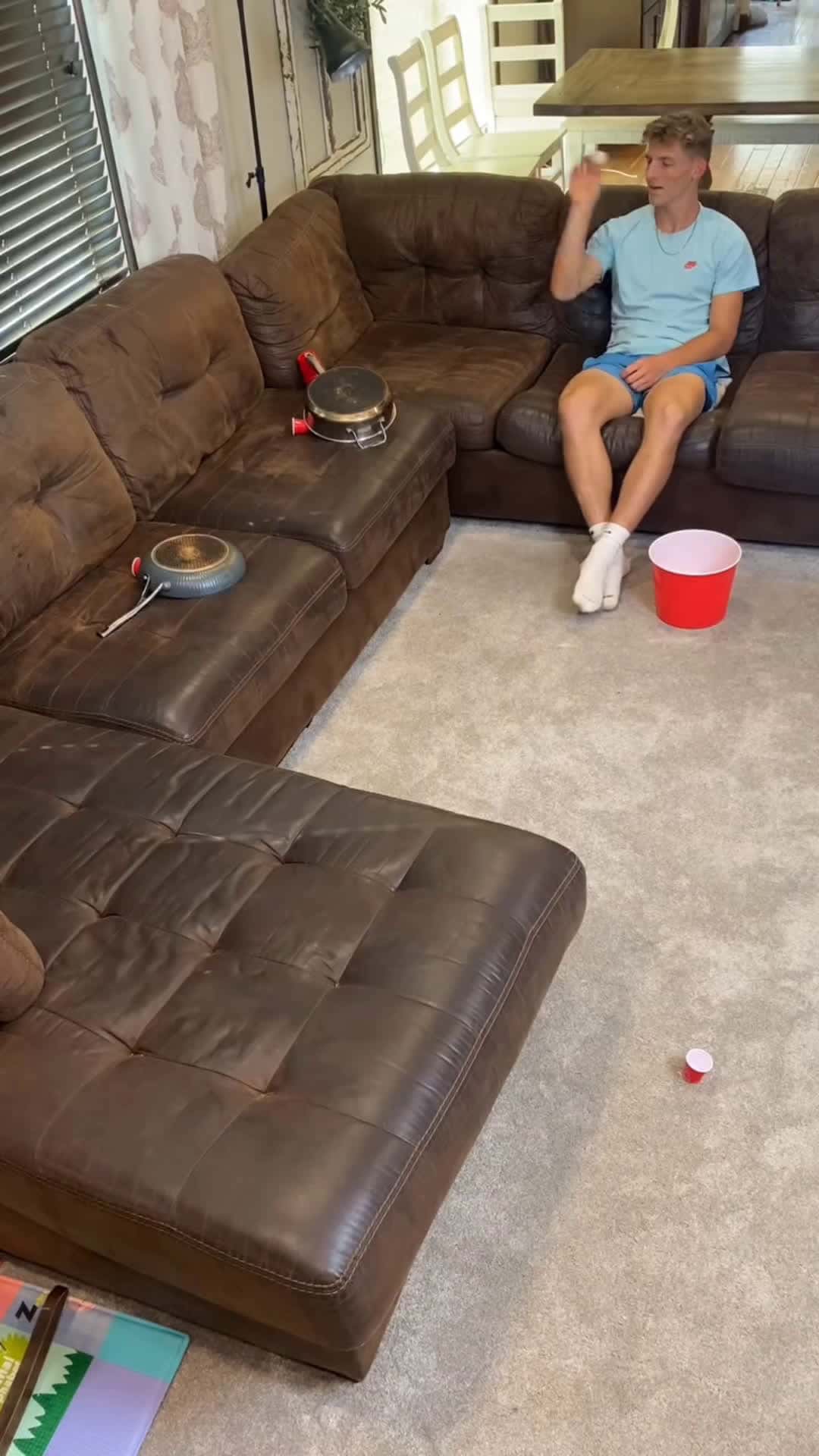 Cover for How Did This Even Happen?? 🤯 A boy attempts an impossible trickshot using pots and pans on a sofa. This took forever.(for entertainment purposes only)