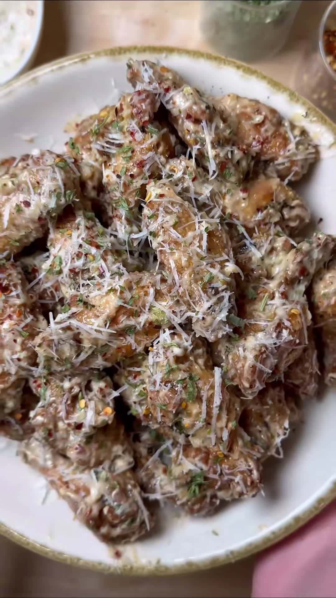 Cover for Garlic Parmesan Wings will always be the best wing flavour- that and Hot BBQ 🙌🏽 Recipe ⬇️ 3 lbs chicken wings 3 tbsp avocado oil  2 tbsp white vinegar  2 tsp old bay  Salt & pepper  *airfry at 375 for 12-15 minutes, flip and airfry at 375 for another 12-15 minutes 1 cup mayo 3 garlic cloves (minced) 1/2 tsp onion powder  1 tsp Dried parsley  1 tsp Red pepper flakes  1/4 tsp Thyme  1/4 tsp oregano  1 tbsp White vinegar  1 tbsp Lemon juice  Salt & Pepper  1/2 cup parmesan cheese (or pecorino Rom