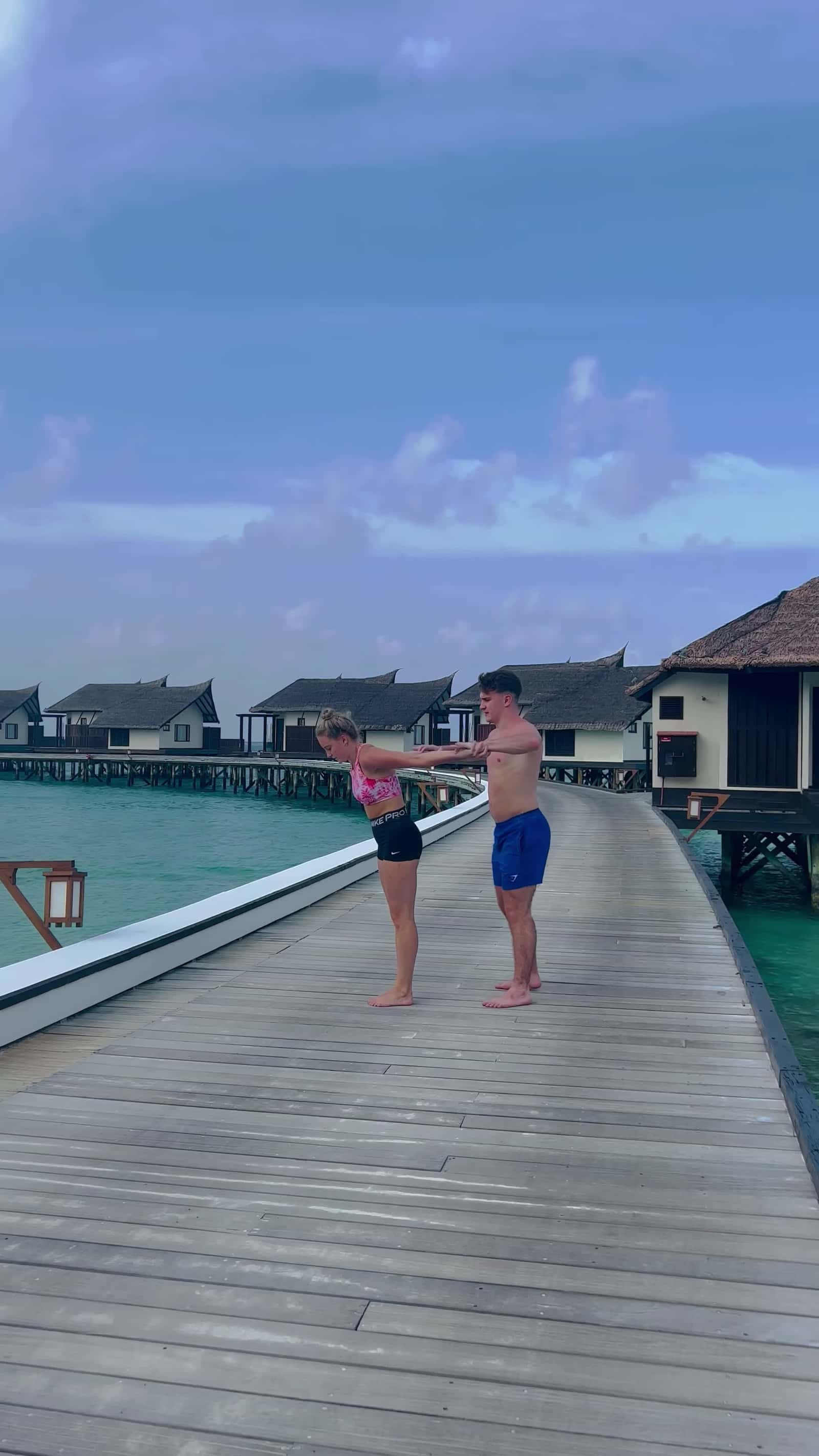 Cover for #FirstVideoChallenge Duo Perform Acrobatic Move on Walkway.