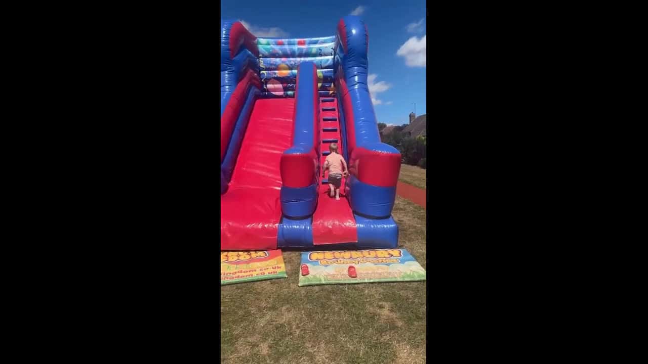 Cover for Little boy misjudges bouncy slide and ends with a faceplant