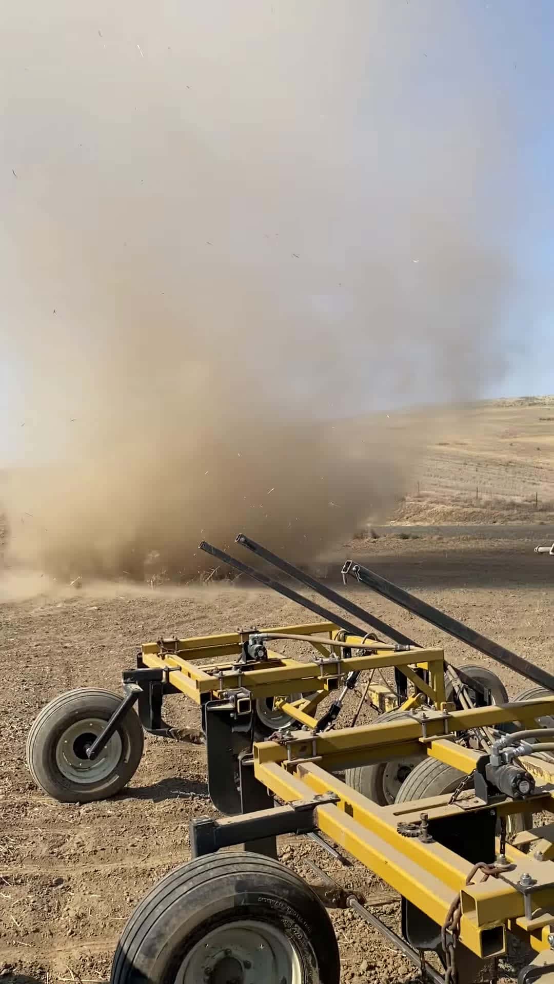 Cover for #FirstVideoChallenge Dust Devil Passes by Farm Equipment.