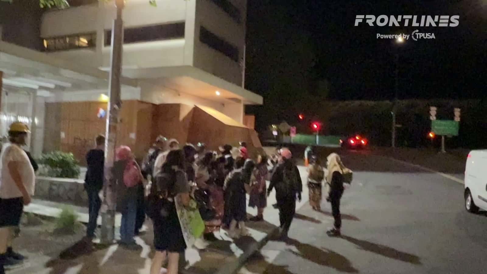 Cover for Federal authorities have released one of the activists detained Monday evening in front of the Portland ICE facility. The young woman in the skirt just said: “My mom is still in there they denied her medical care three times.”  Still unclear why they were taken into custody. Earlier this evening, they were seen bumping the feds in a melee with Antifa militants.