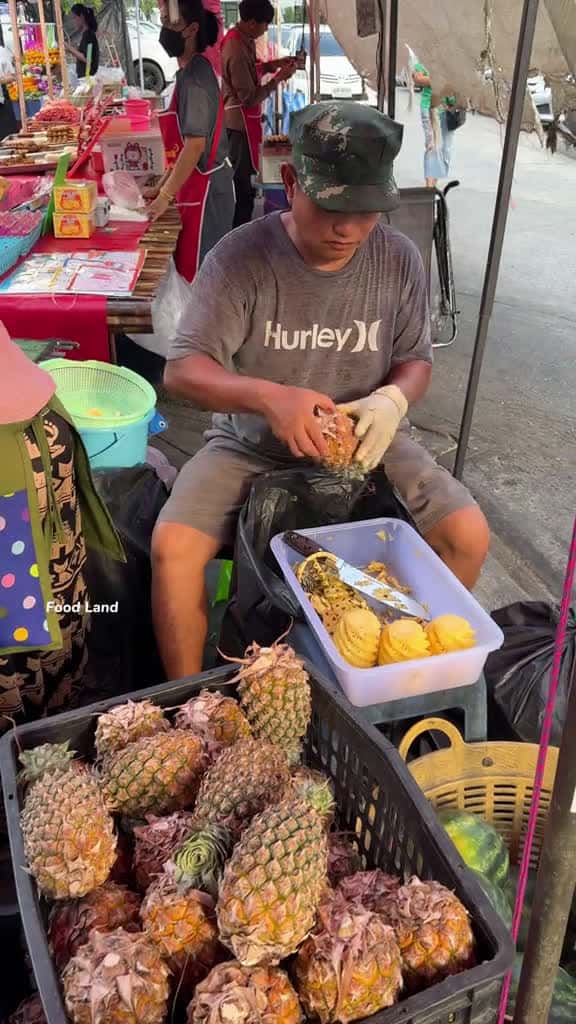 Cover for Fresh pineapple cutting skill . Shop name Location V Market Lard kra bang Bangkok Thailand 03326 #us