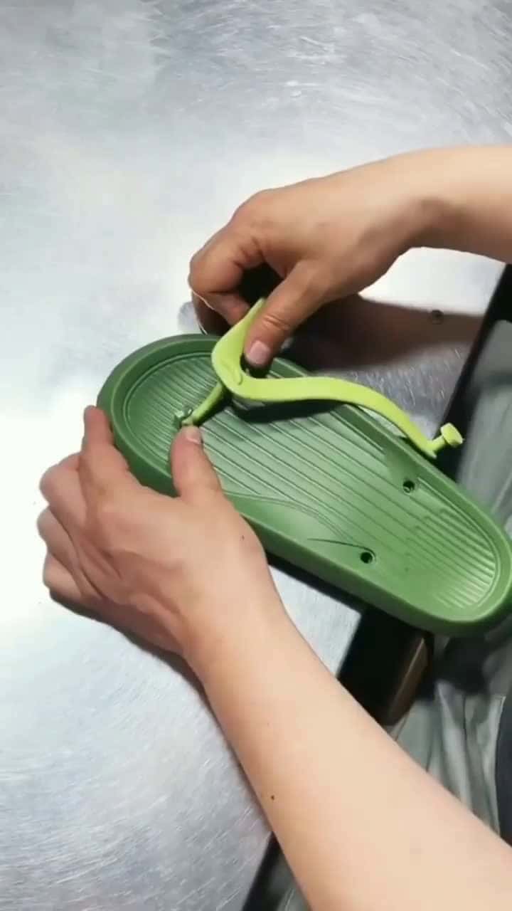 Cover for follow us for more Heres how a strap is put in a flip - flop by zuoken (Duyin) #flipflops #flipflop #production #manufacturing #howitsmade #howitsdone #oddlysatisfying #satis