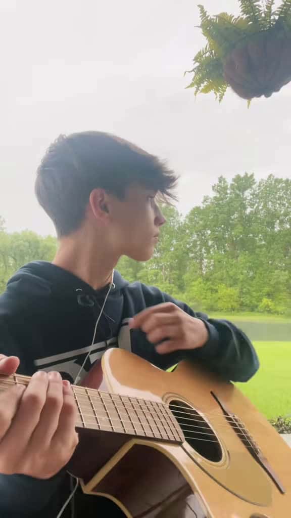 Cover for Playing guitar in the rain just hits different 🌧️🎸 #acousticguitar #music #fyp #guitar