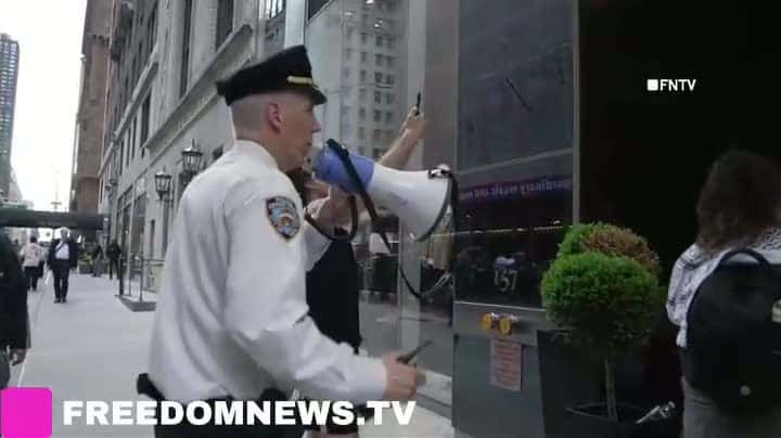 Cover for Mass Arrests at 'Billionaires Home' in Midtown on Earth DayApril 22 2025 - MANHATTAN, New York: Climate Protesters block building entrance and roadway in Midtown Manhattan.The group gathered at Columbus Circle as part of a se...