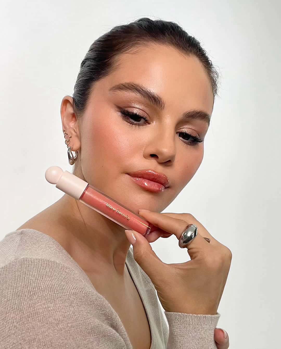Cover for This is the new @rarebeauty I showed you a couple months ago btw 🥰 Positive Light Luminizing Lip Gloss is here just in time for summer.. #fyp 
