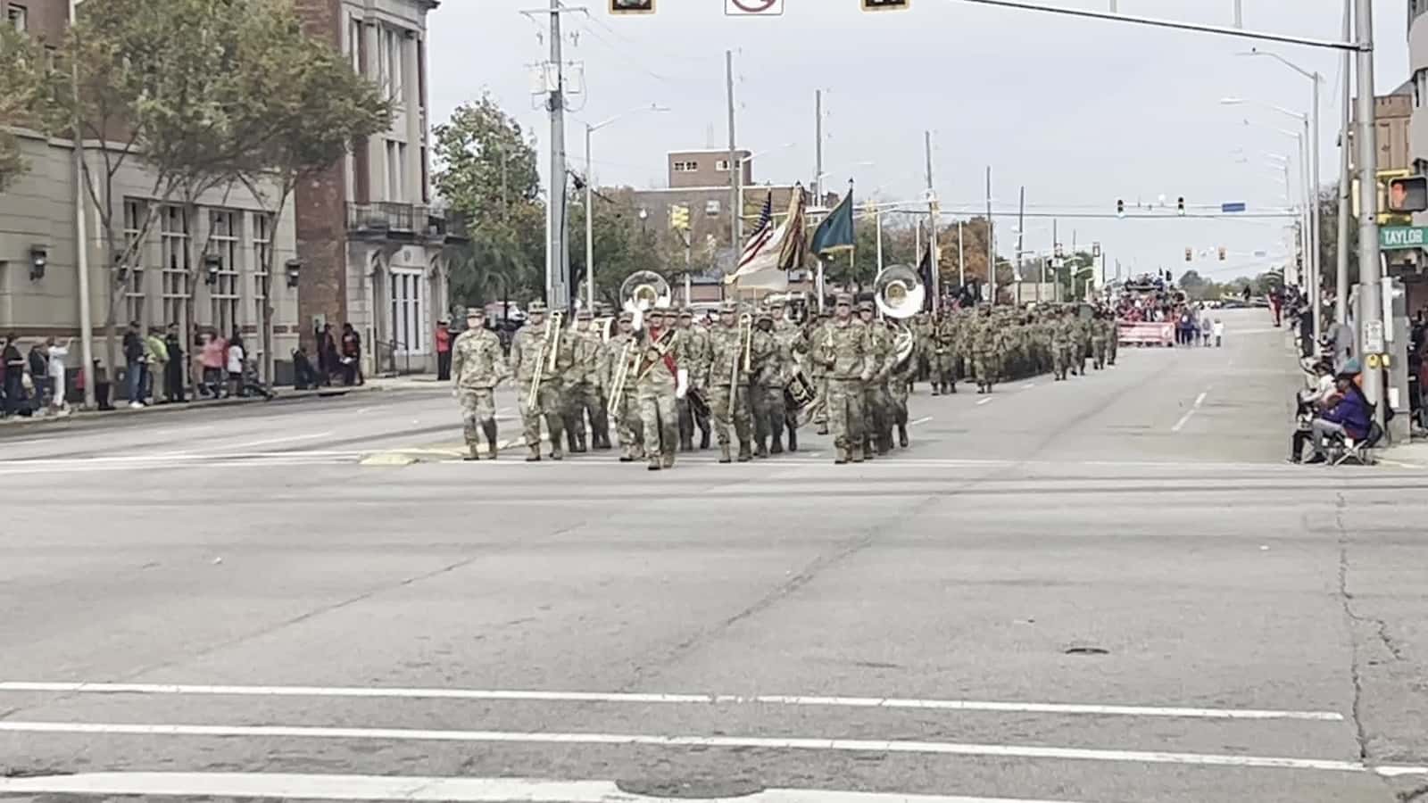 Cover for U.S. Army Band and marching unit from Fort Jackson, S.C. in a Veterans Day Parade