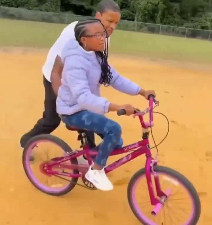 Cover for Dad helps his blind daughter ride a bike for the first time 🚴‍♀️ #Inspiring #FamilyGoals #BlindAwareness