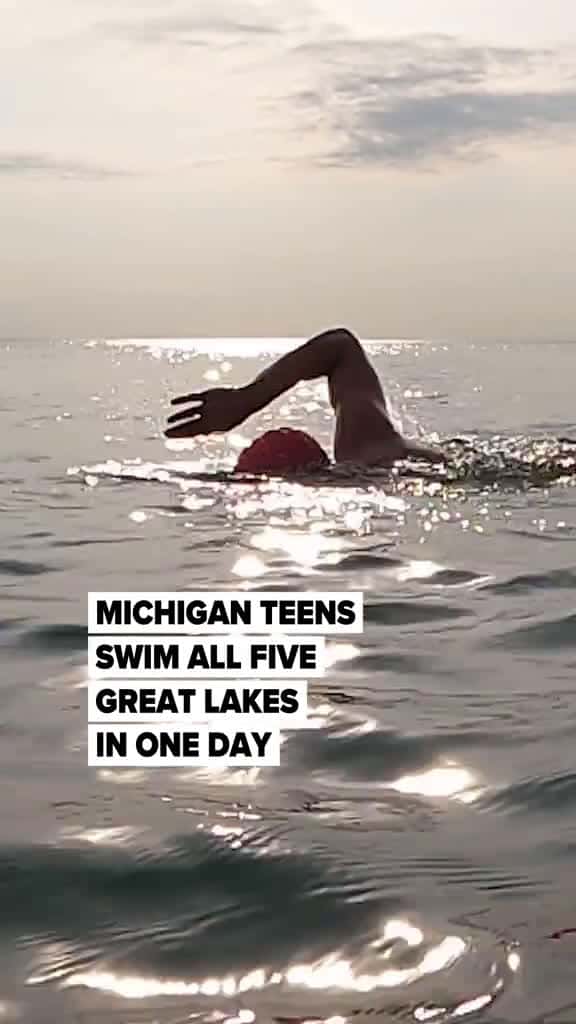 Cover for At 4:46 a.m., 11 Michigan teenagers stood on the Canadian shore of Lake Erie looking out at the black water. They waded in and, “On three!” they dove under and started to swim. It was the first Great Lake to tick off on their m...