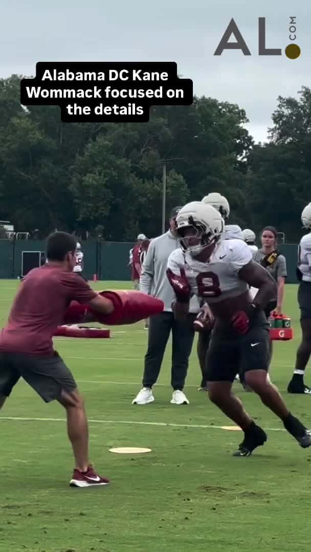 Cover for Alabama defensive coordinator Kane Wommack floats to each position group during practices to work with different guys