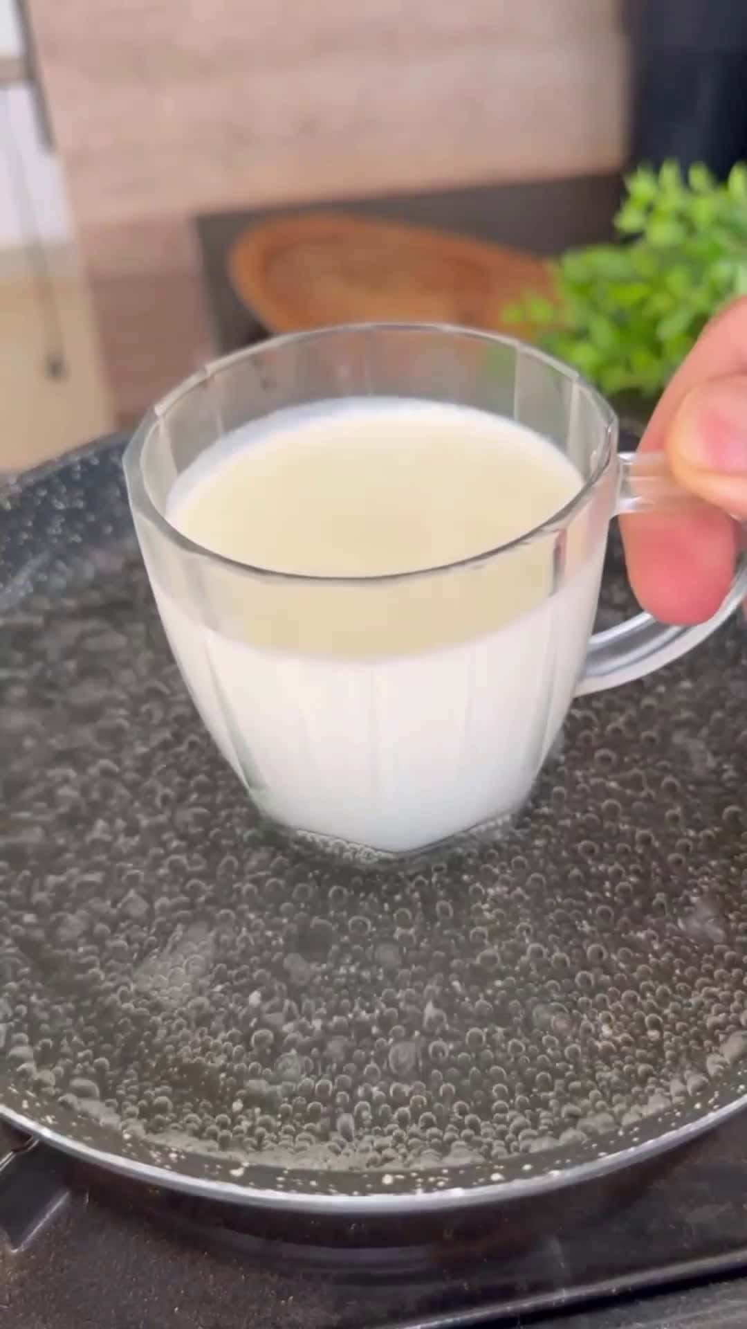 Cover for Put the milk in boiling water to...