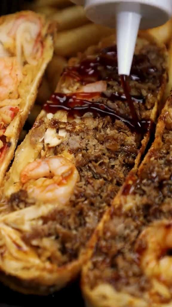 Cover for You know World Famous got you Slide through and dive into our Seafood Deluxe Eggroll match 77934 #trendingscoopz