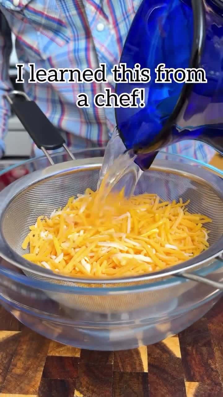 Cover for 🧀 Rinsing packaged shredded cheese removes anti-caking agents like starch! #cheese #cookingtips #lifehacks 