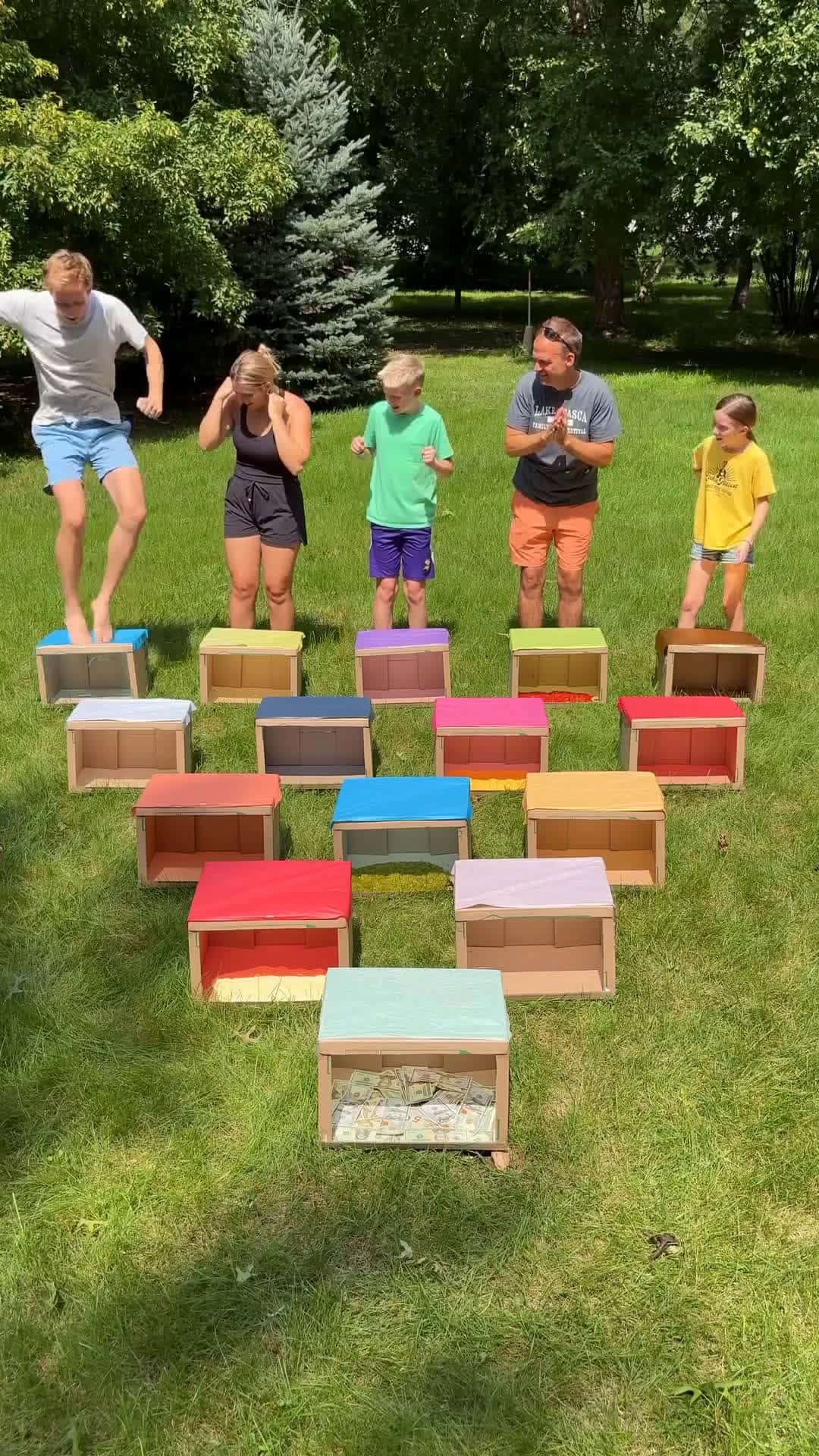 Cover for Don't Jump in the Wrong Box 😂Dad and kids play funny family yard roulette game where they each are jumping in to boxes, but one of the boxes has a condiment inside.