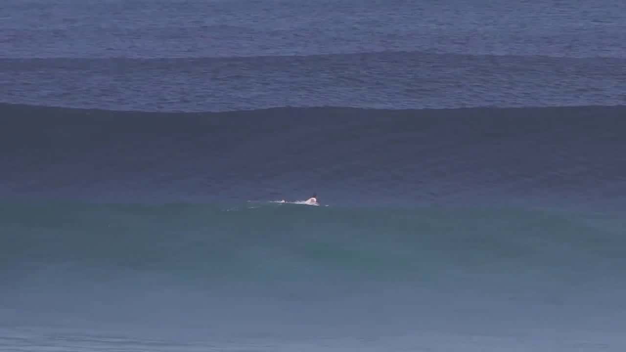 Cover for Massive Wave Breaks Right In Front Of Surfer (Opening Scene) Uluwatu