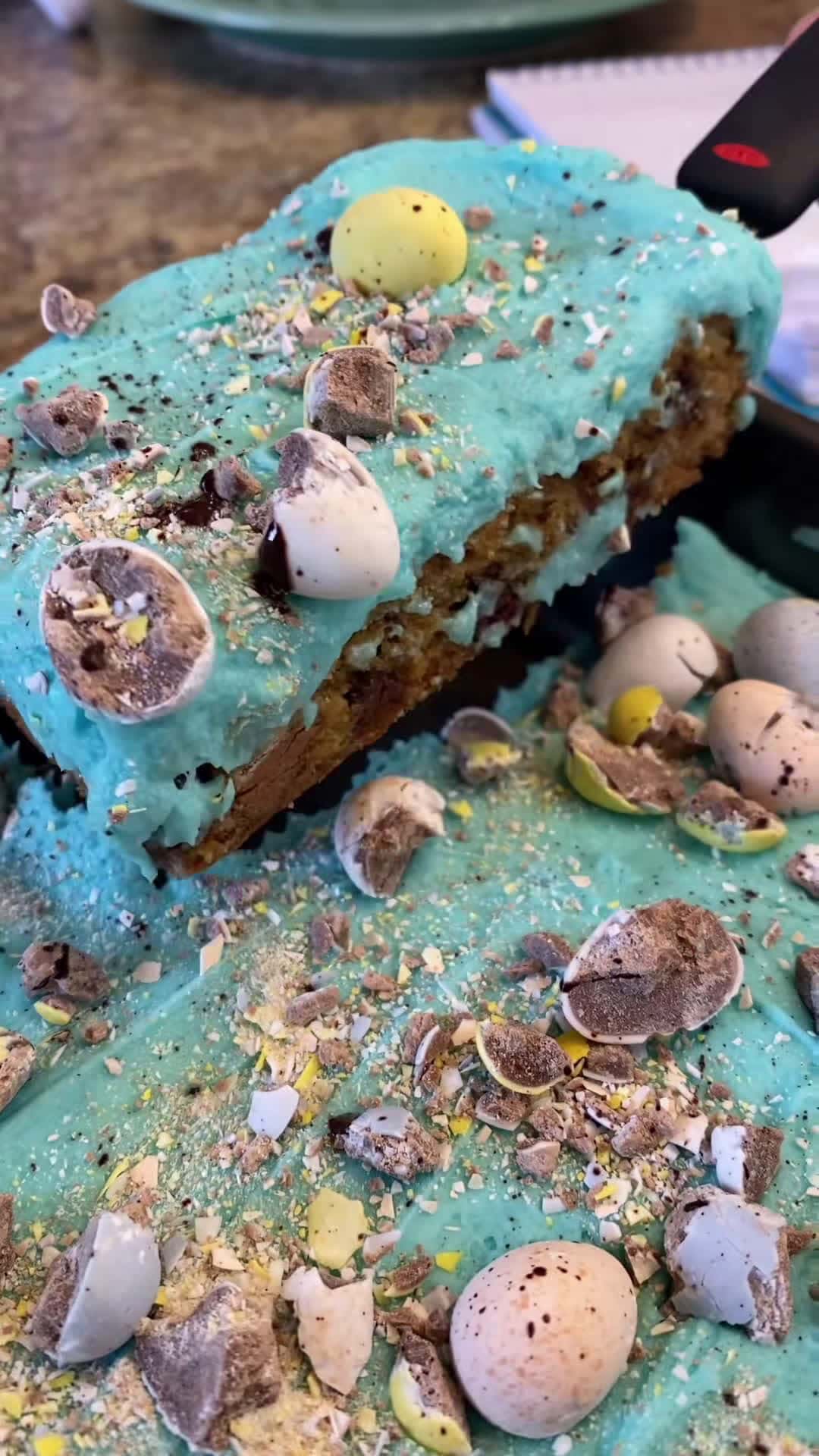 Cover for Cadbury egg cookie bars! 3/4 cup melted butter, 1 cup brown sugar, 1/3 cup sugar. Mix. Add 2 eggs and mix. Add 1 tbsp vanilla and mix. Add 1 tbsp cornstarch, 1/2 tsp baking soda, and 1/2 tsp salt. Mix. Add 2 cups flour and mix. Fold in 2/3 cups semi- sweet chocolate chips & 1 cup roughly chopped cadbury eggs. Pour in a lined and sprayed 9 x 13 pan. Bake at 350 for 23-27 mins until edges are browned. Let cool. For the frosting: 3/4 cup softened (one and 1/2 sticks) butter, 3-4 cups powdered sugar