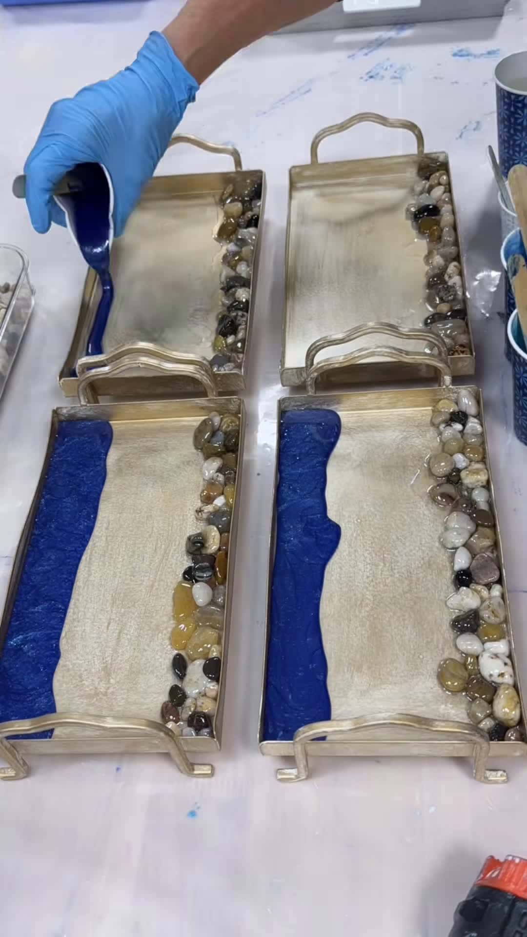 Cover for Pouring epoxy resin waves into these decorative trays! They make great gift ideas! Check out my Etsy shop. You can find them in the featured listings at the top. Link in bio #karenhammondart #christmas #christmasgifts #christmasgift #etsy #etsyshop #etsygifts