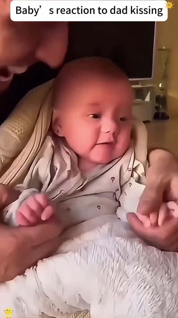 Cover for Baby is reaction to dad kissing funnyvideos usa tiktok funny usa interesting baby 01582 #shortvideos