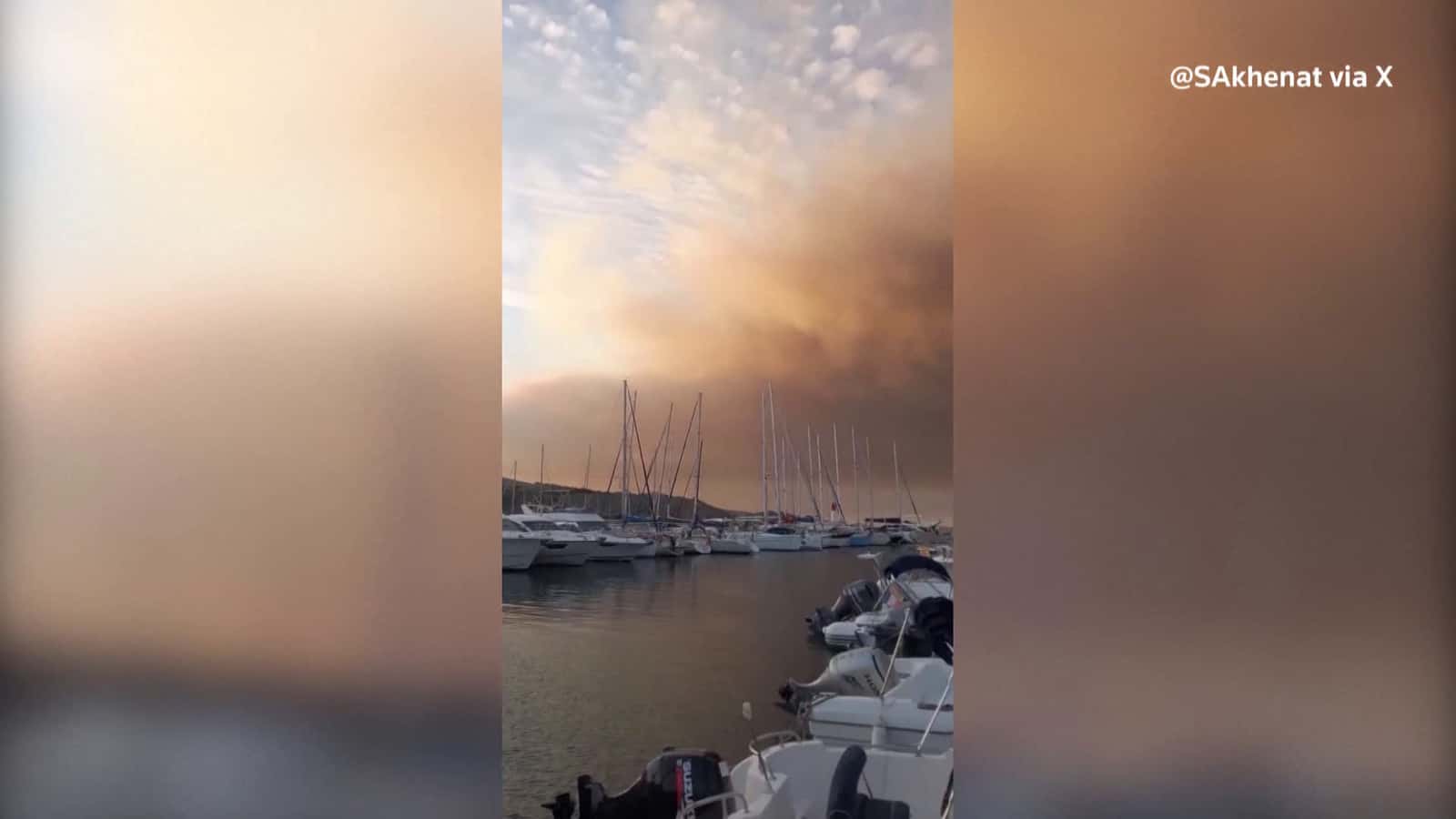 Cover for Smoke rises over the coast in southern France as wildfire rages on