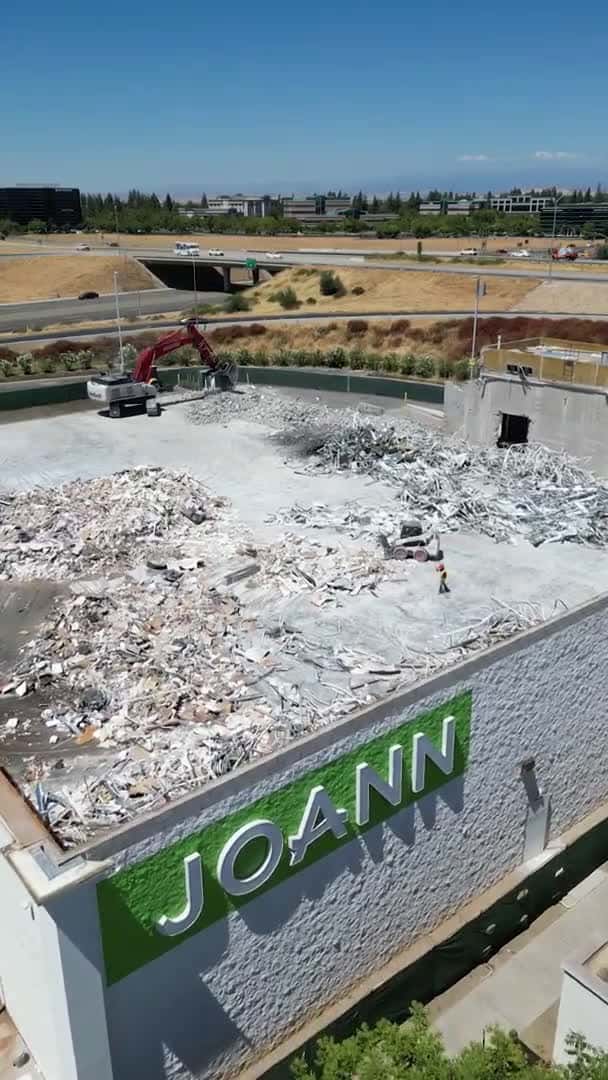 Cover for Machinery started tearing down walls Saturday at the former Joann fabric and crafts store in Fresno’s River Park Plaza and, by Monday, all that remained was two walls and a pile of rubble.The store closed earlier this year — a...