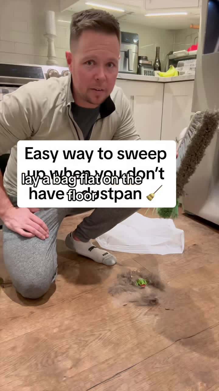 Cover for This is my favorite way to sweep 🧹up when I don’t have a dustpan 🙌 It actually work better than a dust pan because There’s no lip to sweep the dust and dirt over. 👍 All you need is a grocery bag or garbage bag and some painters tape. #cleantok #home #cleaning #cleaninghacks