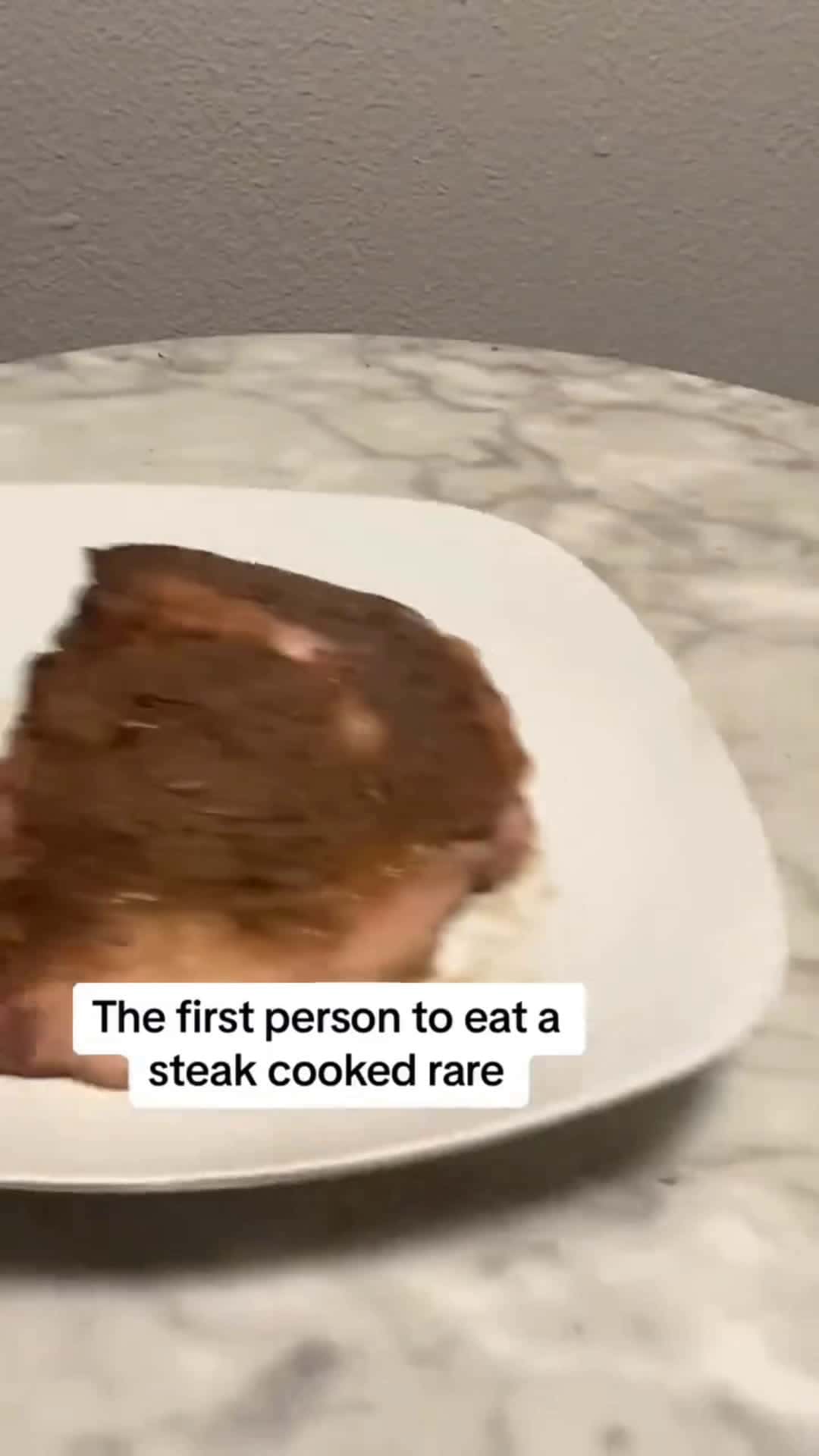 Cover for The first person to eat a steak cooked RARE😆