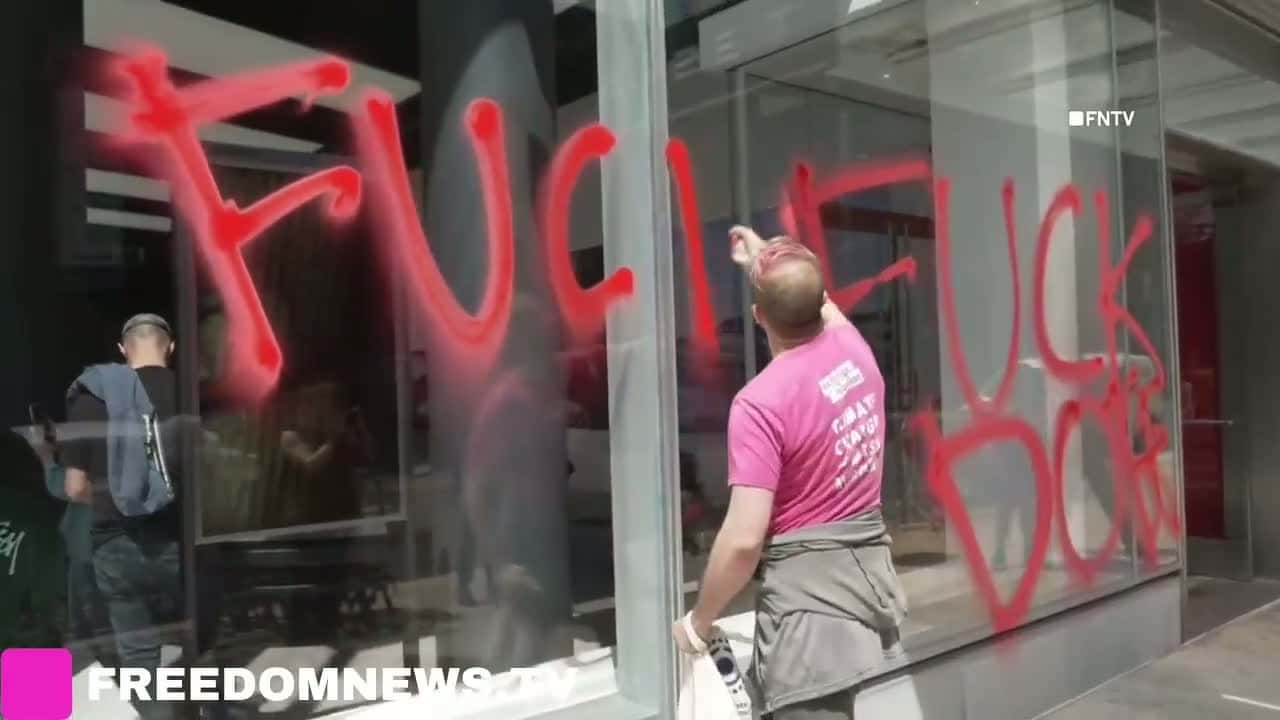 Cover for Arrests as TESLA Dealerships DEFACED in Manhattan on Earth DayApril 22 2025 Two climate activists arrested after defacing windows of Meatpacking District TESLA Showroom.Extinction Rebellion tagged "F Off DOGE" and "WE DO NOT ...