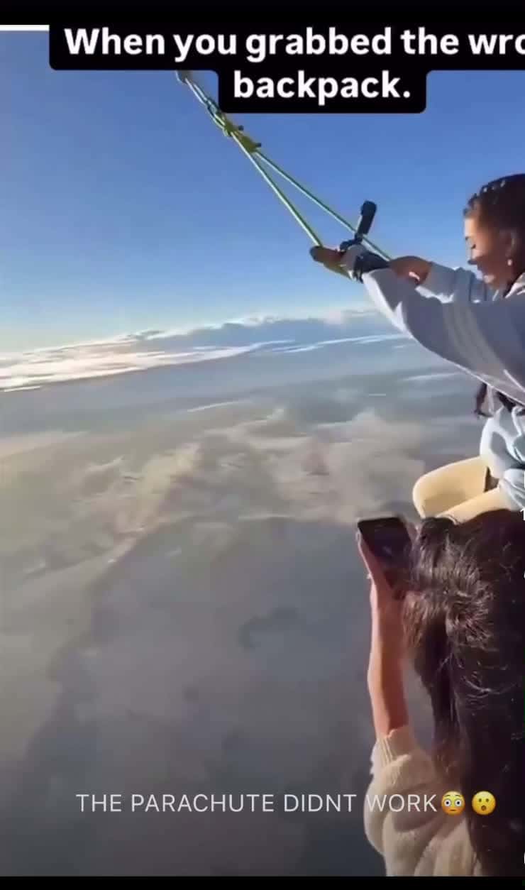 Cover for Women grabs wrong backpack and parachute don’t work.