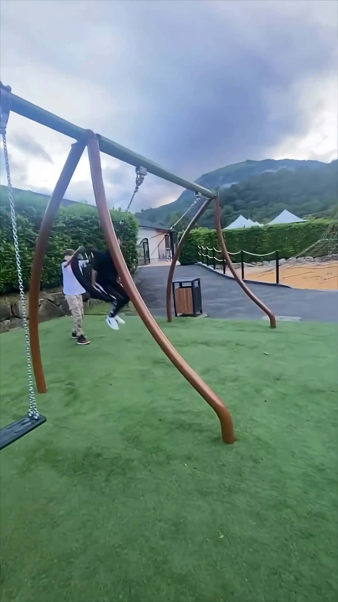 Cover for Boy Falls, Friend Gently Rocks Him on Swing