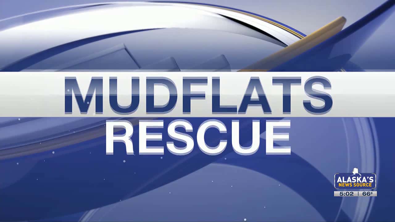 Cover for Solo Fisherman rescued from mudflats after being trapped waist deep in mud