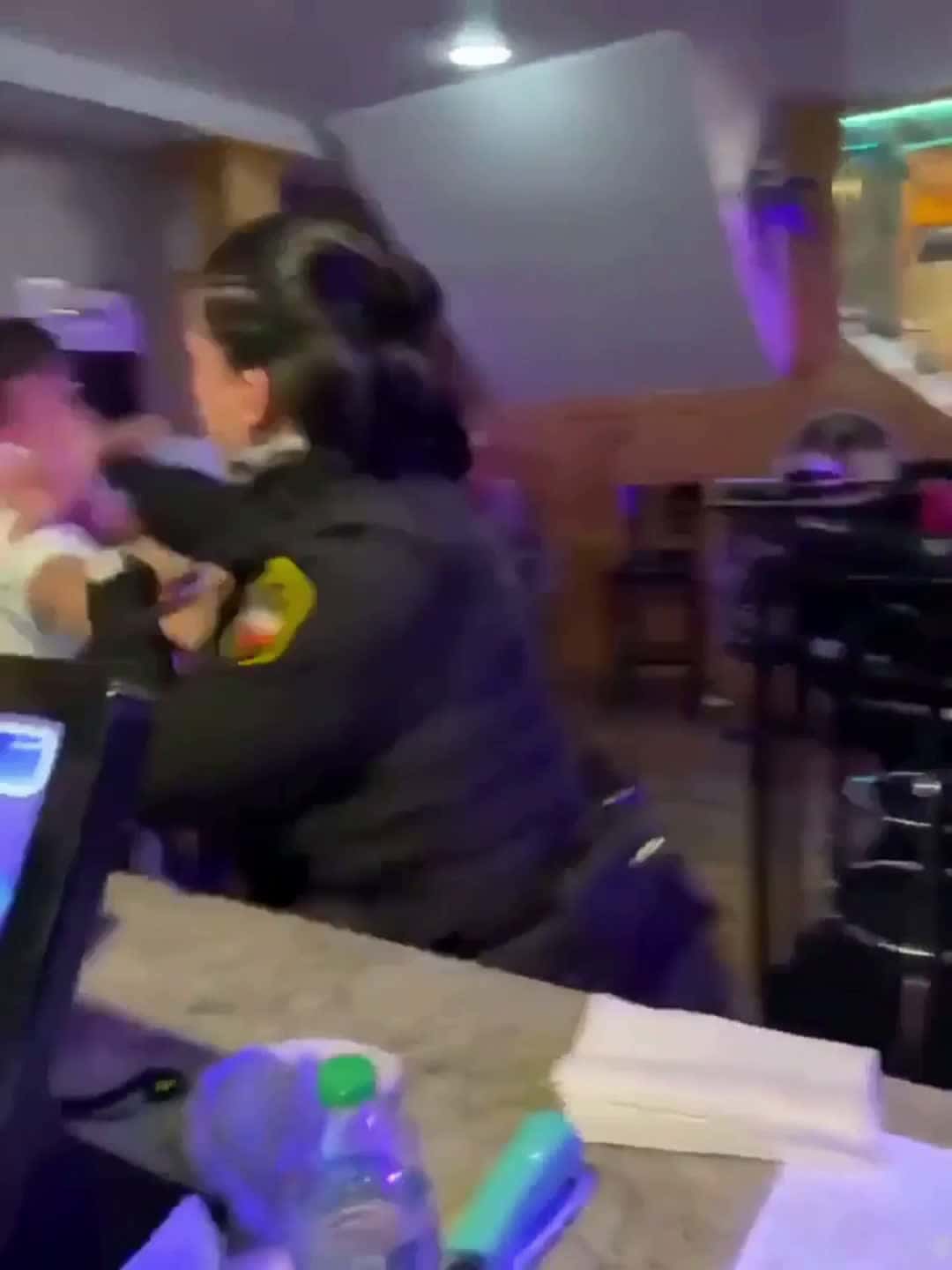 Cover for Women interest in hitting cop during fight