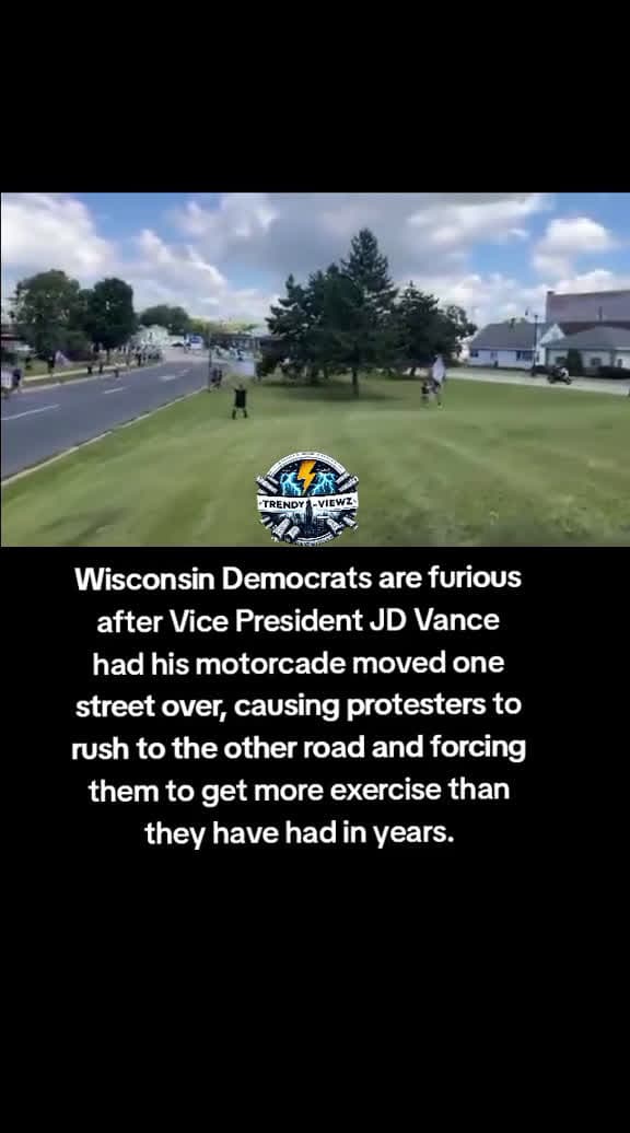 cover for #Wisconsin #Democrats are furious after Vice President #JDVance had his motorcade moved one street over, causing protesters to rush to the other road and forcing them to get more #exercise than they have had in years.  created ...