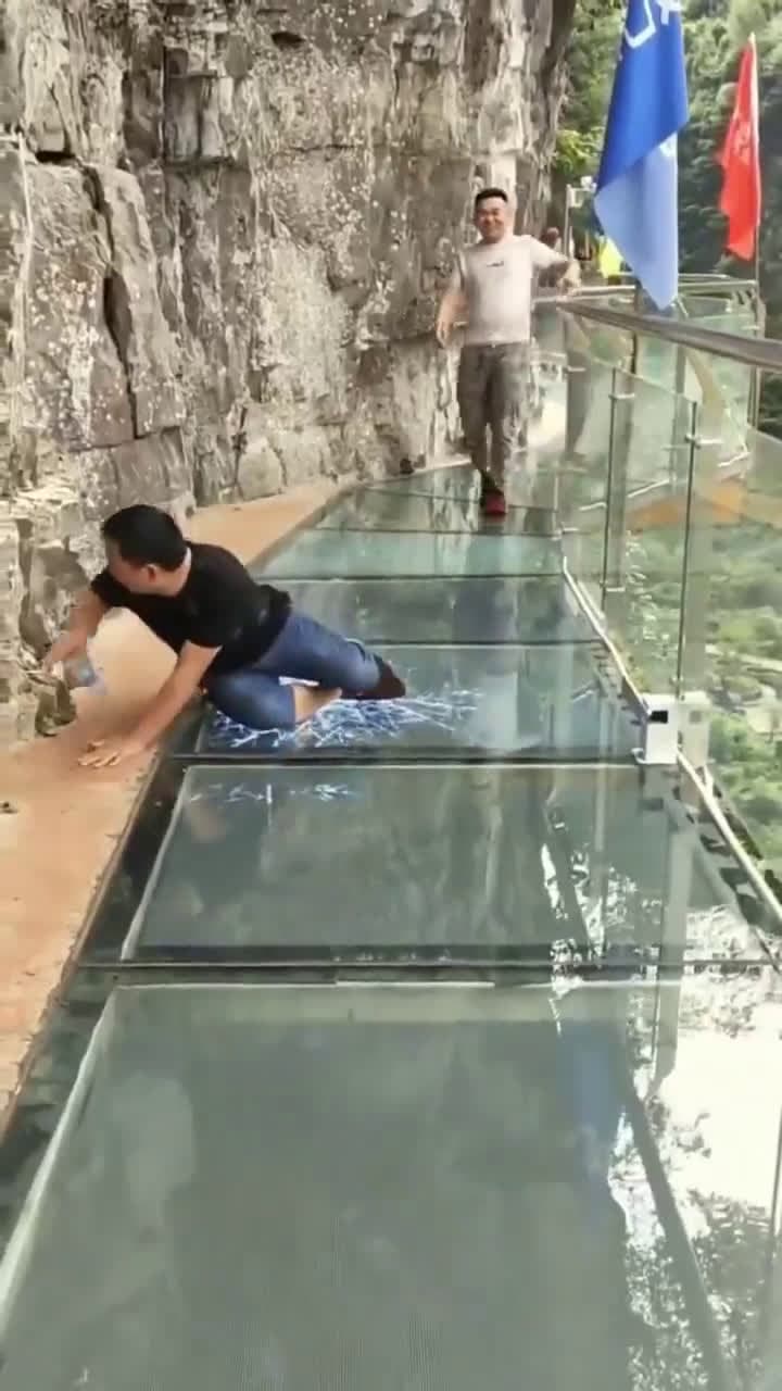 cover for Daredevil walk on a glass bridge as it cracks beneath their feet 😳 Will it hold? #GlassBridge #CrackingMoment #Daredevil #ViralVideo