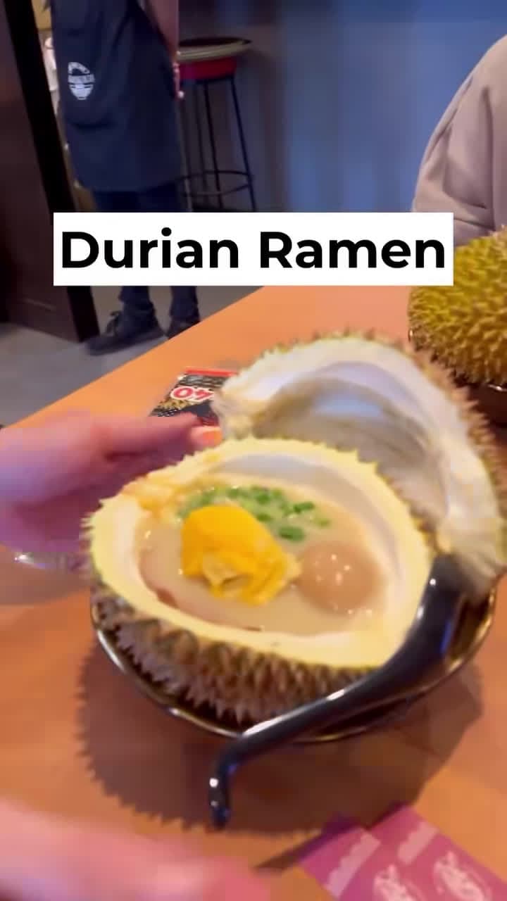 cover for this creative take on ramen is served in durian flesh 🍜 mixed with tonkotsu soup, the combination gives a rich and creamy taste. the toppings include a piece of chashu, a boiled egg, spring onions and a durian pulp. #durianramen #ramenjapan #foodtiktok #durian