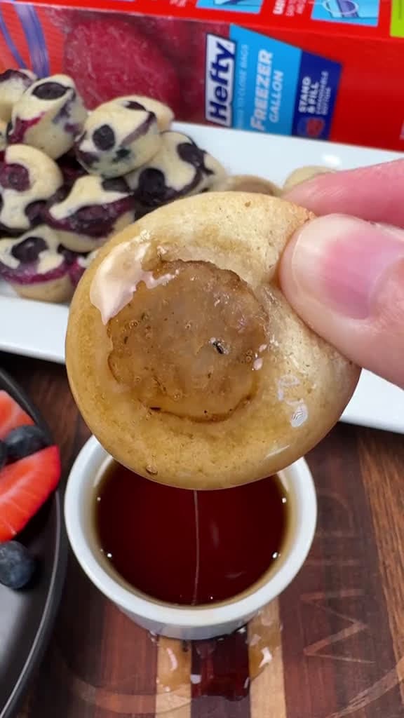 cover for Filling the freezer with three easy pancake breakfast preps in under 30 minutes!  MINI PANCAKE BITES  INGREDIENTS  2 cups of Pancake Mix + ingredients needed to make pancakes  Blueberries  6 sausage links  INSTRUCTIONS   Mix pa...