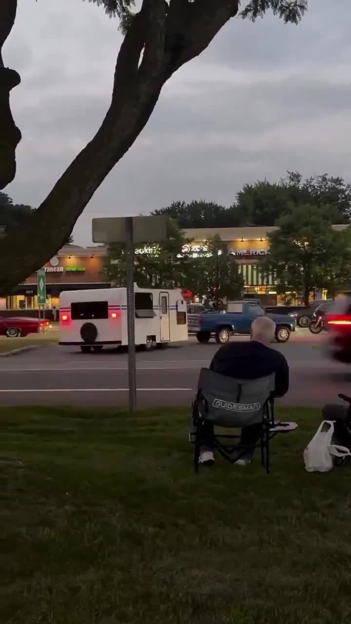 cover for A guy converts his truck and trailer to appear that it is driving backwards.