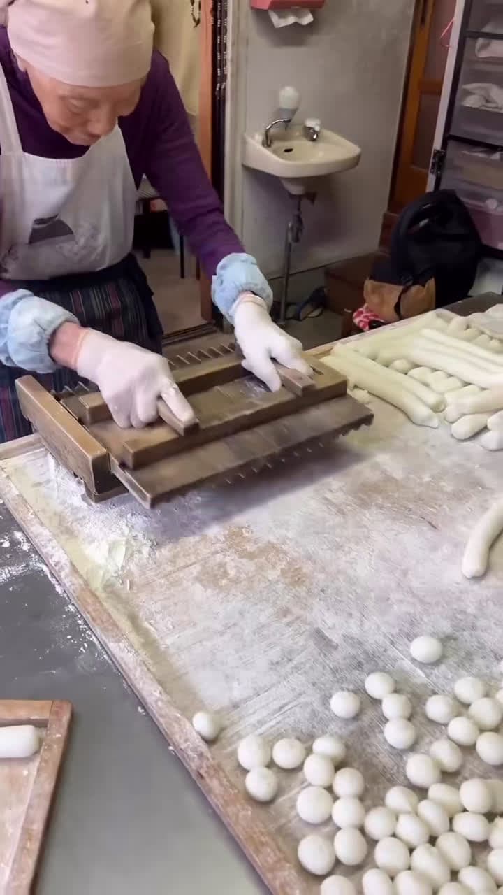 cover for have you tried mitarashi dango dumplings? this spot in kyoto is run by a local 94-year-old woman, and is famous for its 100 yen mitarashi dango dumplings. made from scratch, these are a type of rice flour dumplings lovingly kneaded, steamed, and rolled by hand, before they are skewered and glazed with a homemade sweet soy sauce. mitarashi dango is known to have originated from the kamo mitarashi tea house in the shimogamo area. the dango was thought to be made as an offering for gods and the nam