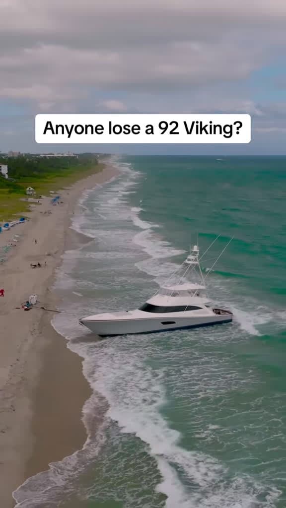 cover for 8-10 ft seas buried a Viking 92 yacht in the sand at Delray Beach—crews racing to free it. What would you do? 🛥️🌊 #vikingyachts #delraybeach #yacht #boating