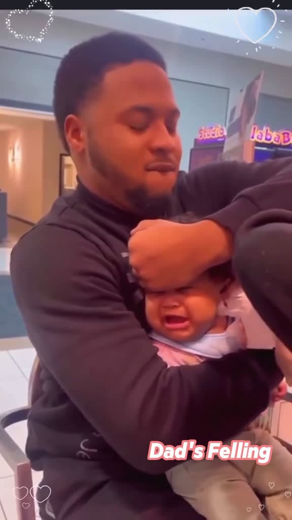 cover for Fathers reaction to their babies ear getting pierced. fathers babie wholesome dad baby mom 36703 #trendingscoopz