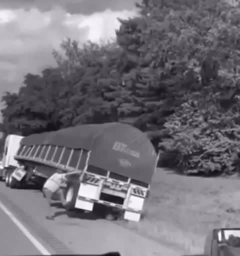 cover for Watch this truck driver stop his truck from tipping over all alone! 😱 #TruckDriver #EpicMoment #NoHelp
