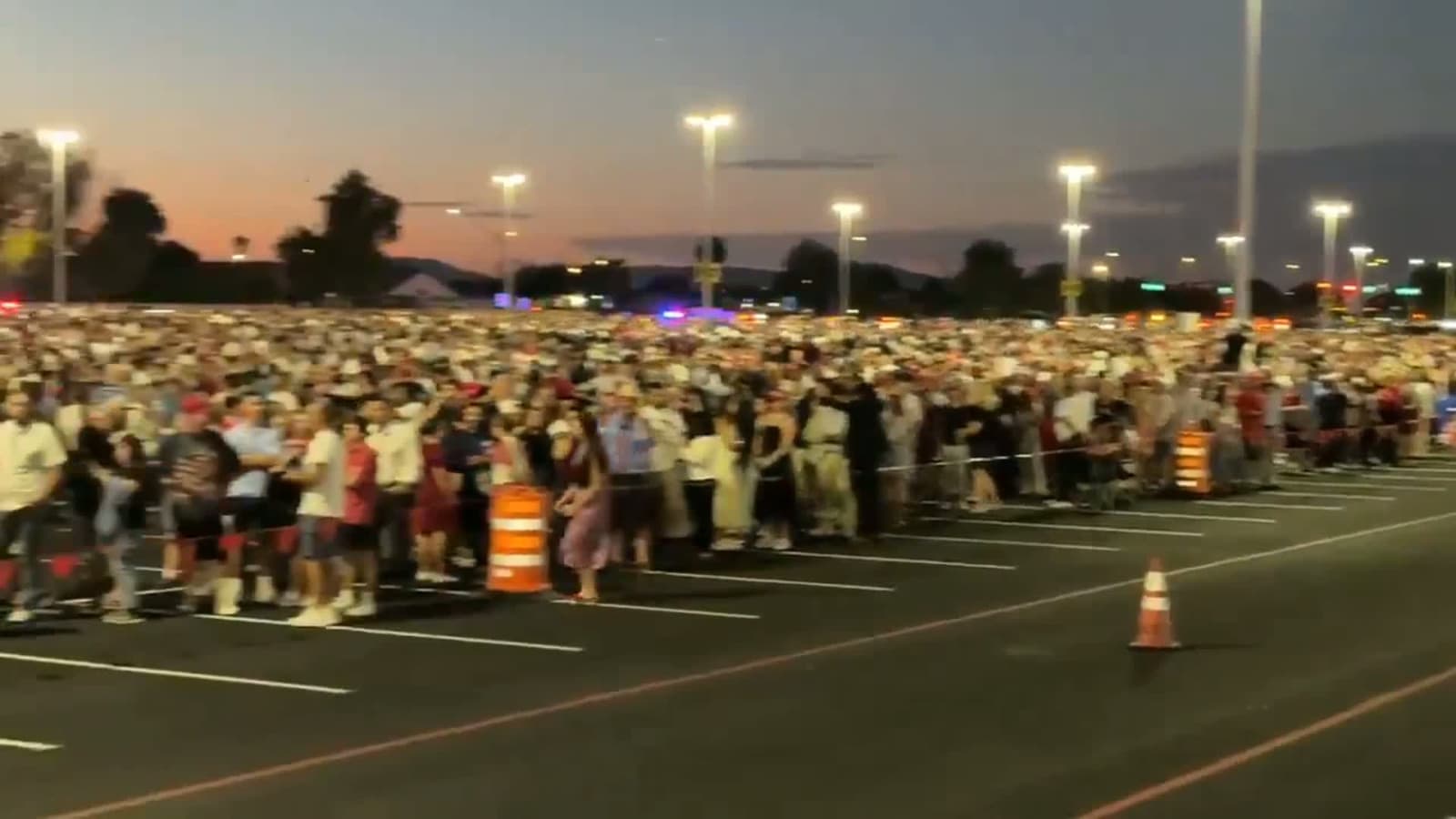 cover for A massive crowd gathered for Charlie Kirk in Arizona, with estimates rising from 100,000 to 300,000.